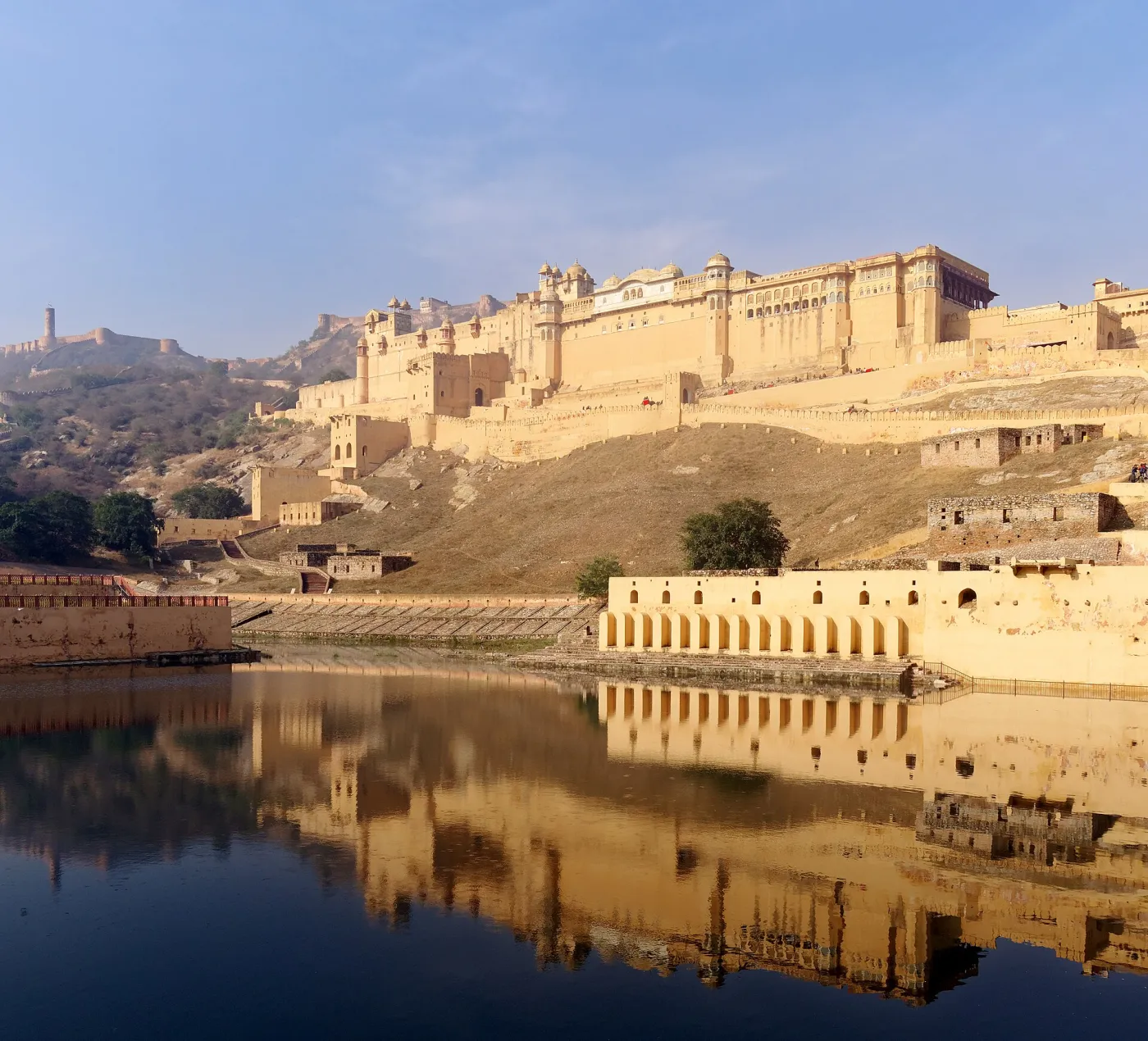 Amber Fort seen from the bank of Maotha Lake, Jaigarh Fort on the hills in the background