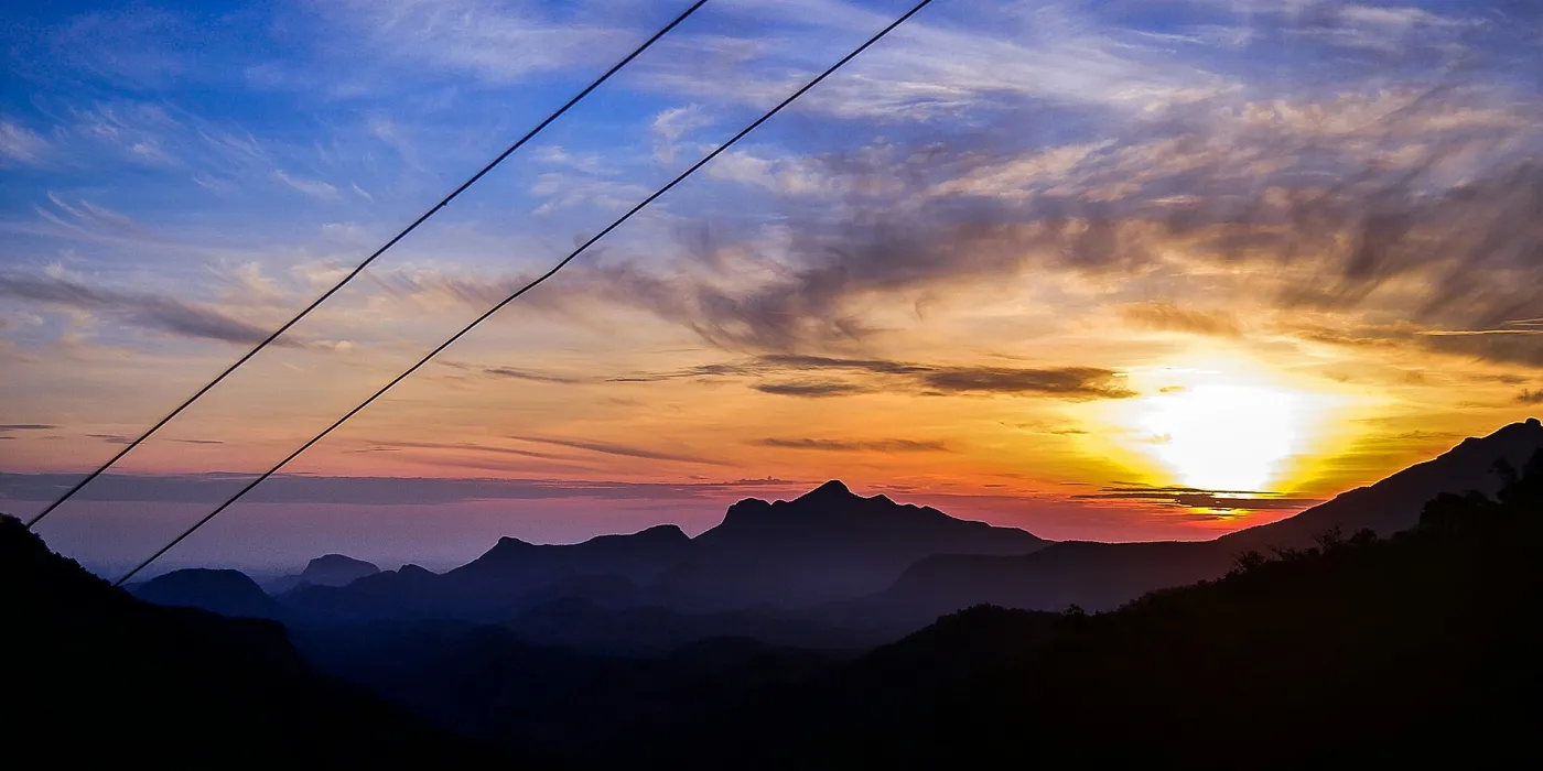 Palani Hills' mountains with sunrise at Marayoor. Looking northeast.